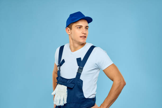 istock Working man in uniform of gloves loader rendering service blue background 2051861795