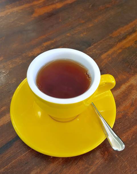 istock Yellow porcelain tea cup 2051881328
