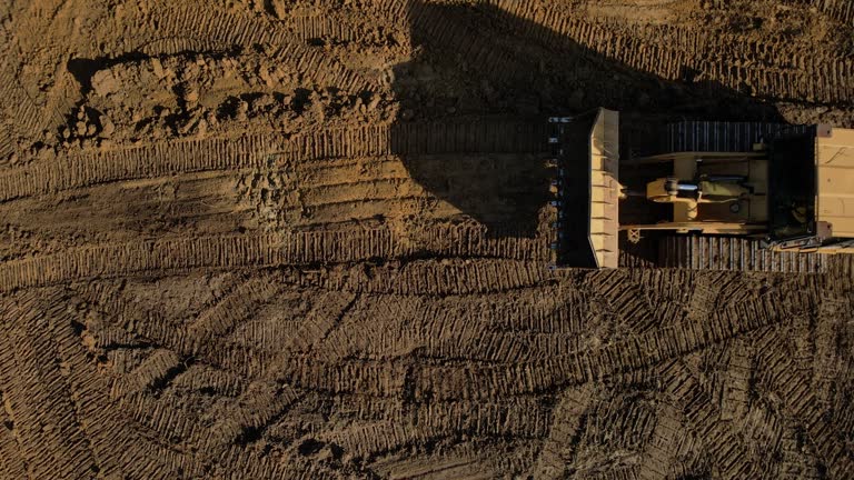 Overhead View ofHeavy Duty Earth Moving Equipment Loader Building Livestock Pond in Midwest USA Missouri Aerial Video