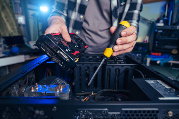 istock The technician repairing the computer. the concept of computer, CPU, motherboard, hardware, repairing, upgrade and technology. 2052032592