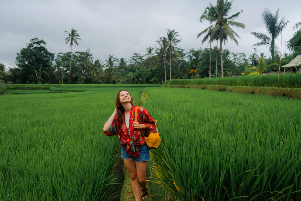 istock Woman walking on rice paddy 2052091602
