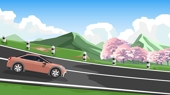 Sedan cars with driving man. On an asphalt road with driving down hills. And surrounded by green grass and eautiful colorful spring trees. Background of green mountain and white clouds and blue sky.