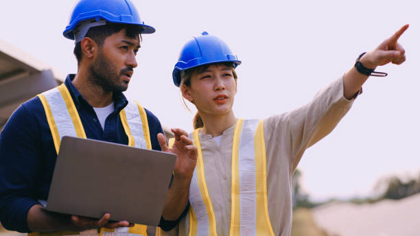 istock Engineers on a solar power plant stock photo. 2052143790