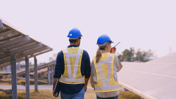 istock Engineers on a solar power plant stock photo. 2052143814
