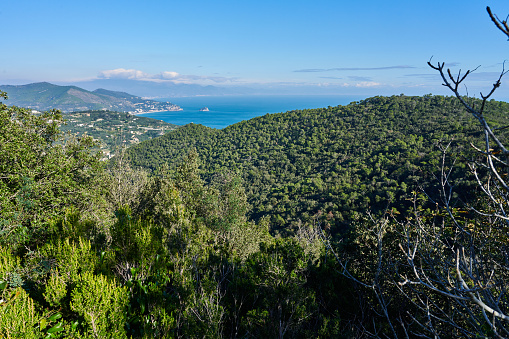 View from a mountain top out across township and towards the ocean and islands