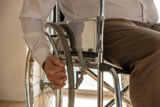 istock A disabled mature man is sitting in a wheelchair. 2052209010