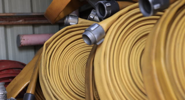 Slow motion Fire fighting sprinklers hose prepared on the shelf, Fire equipment, firehose