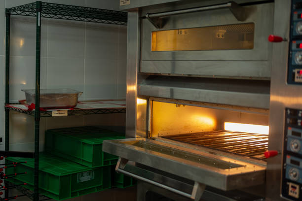 Wide angle view of Commercial kitchen with ovens and grills at a restaurant - Professional Cooking School
