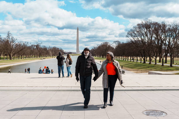 Black senior couple exploring the Washington Mall while visiting Washington DC