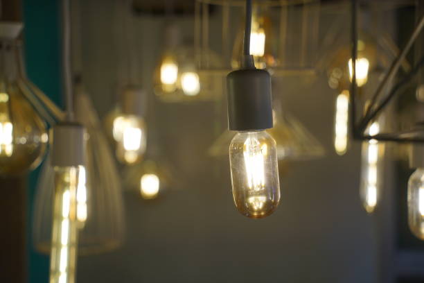 istock Antique style light bulbs hanging from the ceiling 2052312491