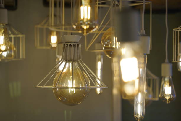 istock Antique style light bulbs hanging from the ceiling 2052312492