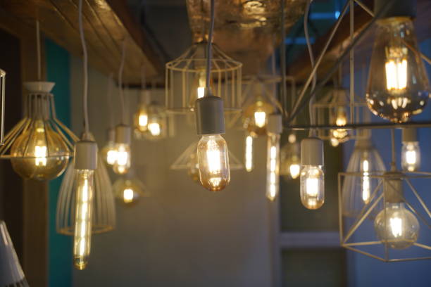 istock Antique style light bulbs hanging from the ceiling 2052313008