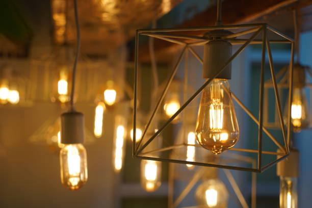 istock Antique style light bulbs hanging from the ceiling 2052313519