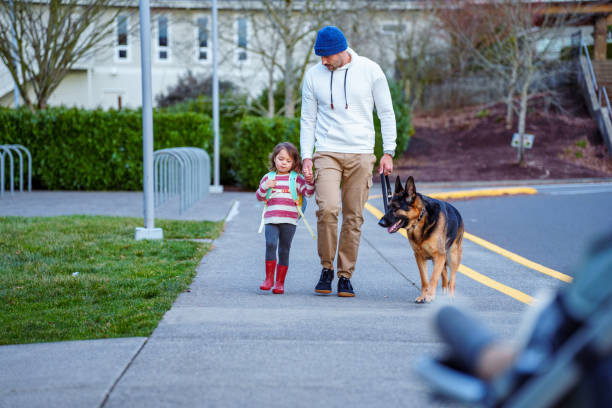 istock Loving dad walking his daughter to school 2052336068