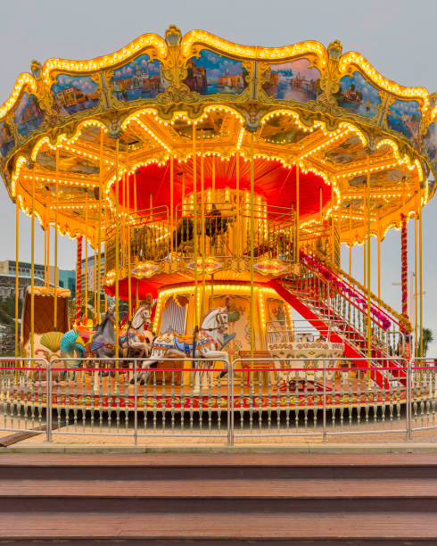 istock carousel attraction with horses close-up in the park 2052345433