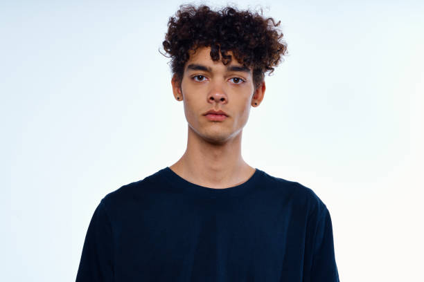 istock cute guy with curly hair cropped view isolated background studio 2052364707