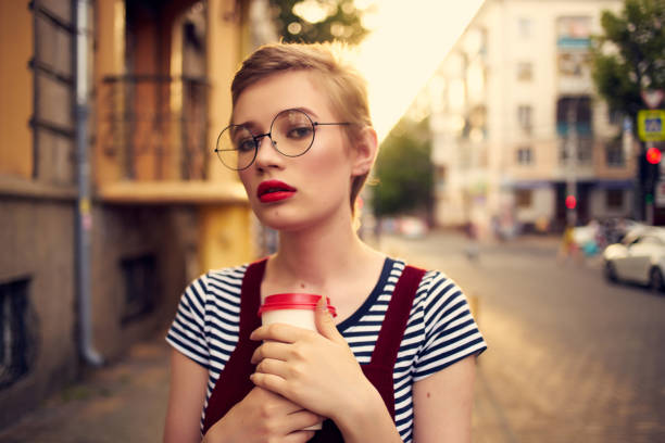 woman with glasses outdoors walk vacation summer. High quality photo