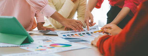 istock Creative design team discusses about interior design at meeting. Variegated. 2052377809