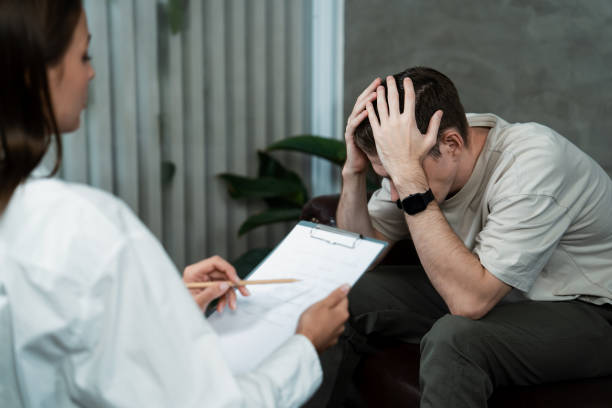 istock Stressed and depressed patient seeking help from psychiatrist. Unveiling 2052394053