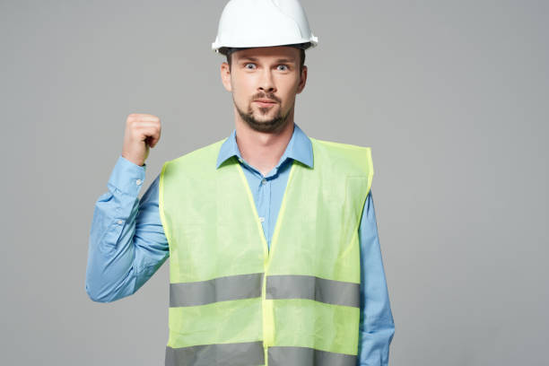 istock man reflective vest Professional Job light background 2052404946