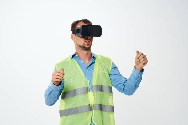 man in working uniform building vr glasses. High quality photo