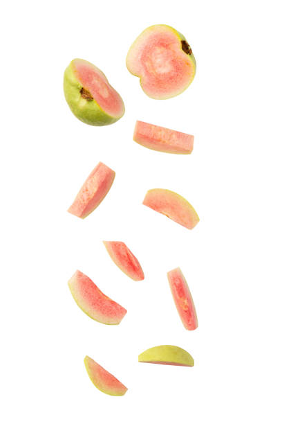 istock Falling Pink Guava slice isolated on white background with clipping path 2052428121