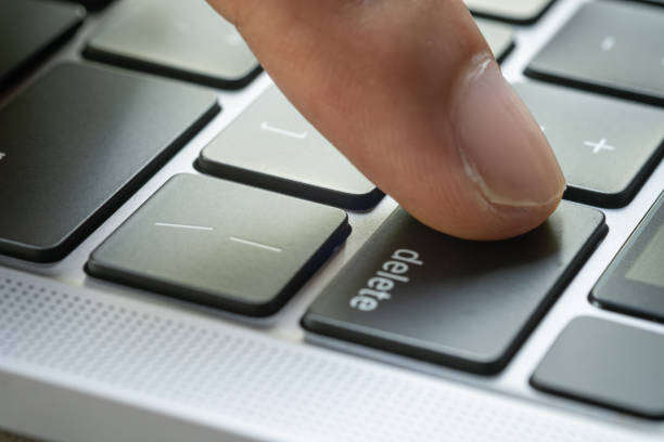istock Finger of the computer user, he presses the delete button on the computer keyboard. 2052429710