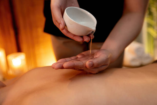 istock Masseuse prepare oil massage procedure for customer at spa. Quiescent 2052432845