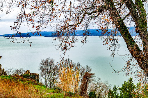 The lake of Trasimeno photographed on an early winter morning.
