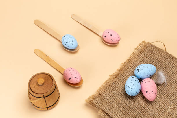 istock Colored Easter eggs on a sackcloth bag and wooden spoons. 2052445149