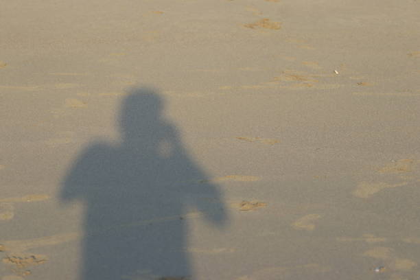 play football on the beach at sunset
