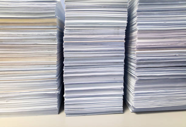 istock Stacks of papers on a table in the office 2052507681