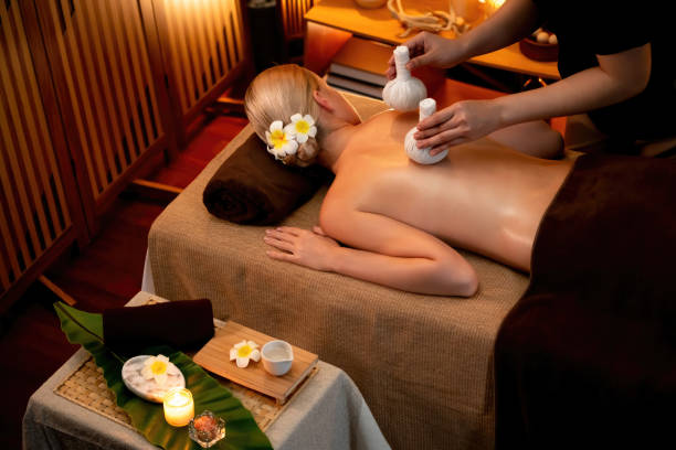 istock Hot herbal ball spa massage body treatment. Quiescent 2052510138