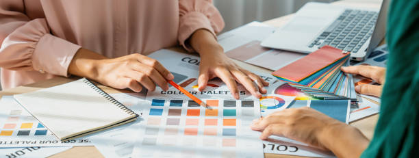 istock Professional interior designer discuss main theme color in project. Variegated. 2052528664