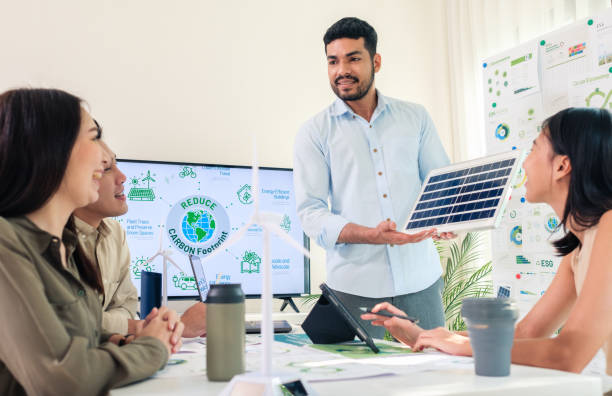 istock Diversity team presentation new design solar cell panel renewable energy innovation at office 2052531407