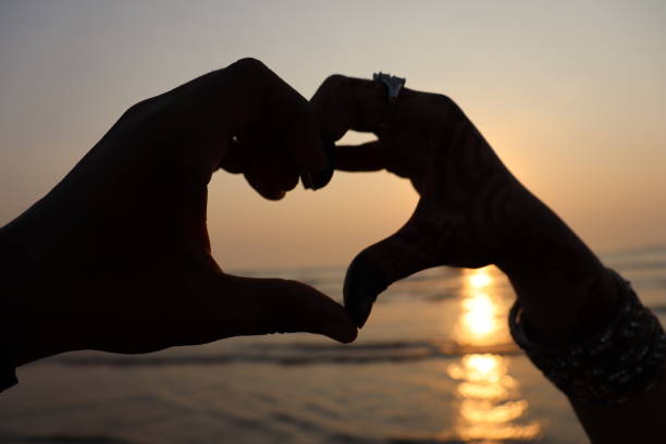 istock Murud Janjiara Beach Photography While Travelling In Alibaug, Mumbai. Hands Making Heart Shape Photography at Beach 2052537802