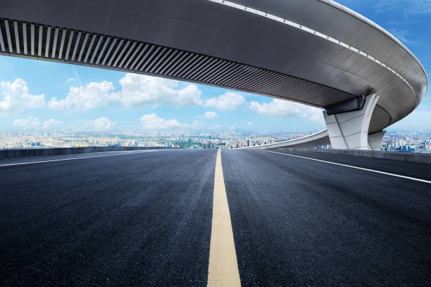 istock Empty asphalt and city buildings skyline 2052537806