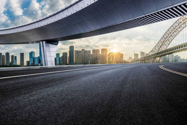 istock Empty asphalt road and city skyline background 2052538929