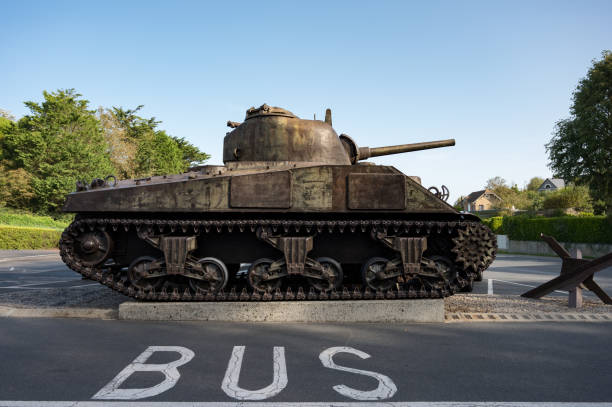 istock Rusty tank with a bus word on the ground in a park. 2052542123