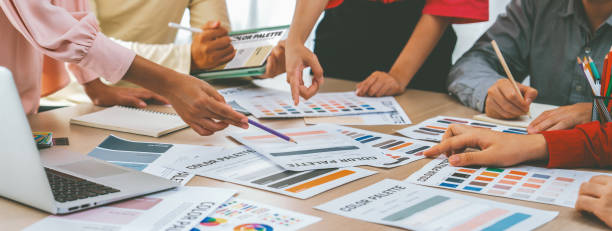 istock Professional architect designer team discuss about color selection. Variegated. 2052544177