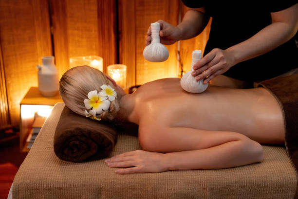 istock Hot herbal ball spa massage body treatment. Quiescent 2052547834