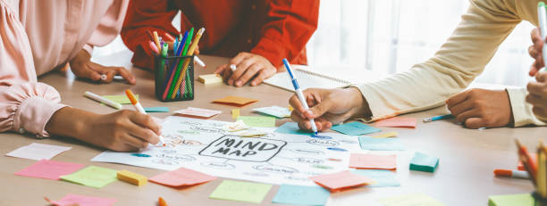 istock Creative business team brainstorming about marketing plan. Closeup. Variegated. 2052555787