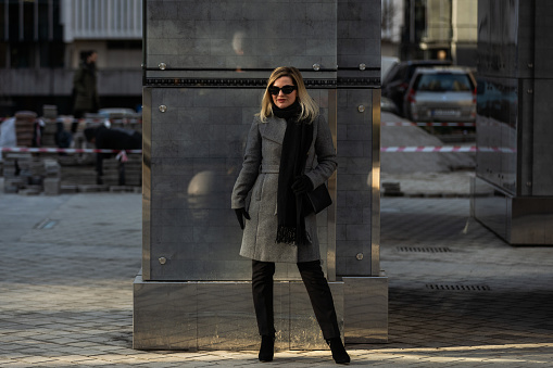 Portrait of a glamorous business woman in the street. High quality photo