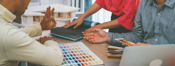 istock Skilled interior design team carefully selecting curtain materials. Variegated. 2052568502