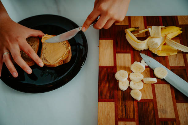 istock Start your day right: Nutrient-rich breakfast featuring a banana and slices of fresh bread 2052577502