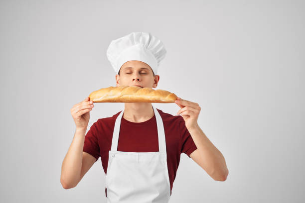 istock chef with loaf in hand baking food preparation professionals 2052584085