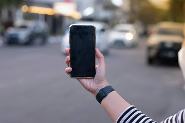 istock Horizontal Image of Female Hand Holding a Smartphone 2052591636