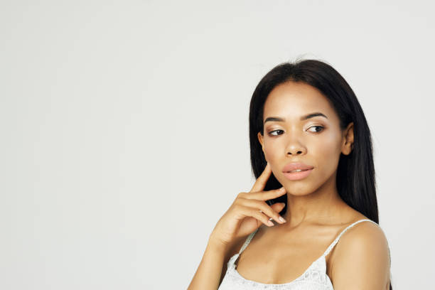 istock woman african appearance attractive look posing close-up cosmetics 2052597621