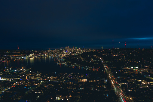 Drone shot of the Seattle, Washington skyline and Lake Union at night in December