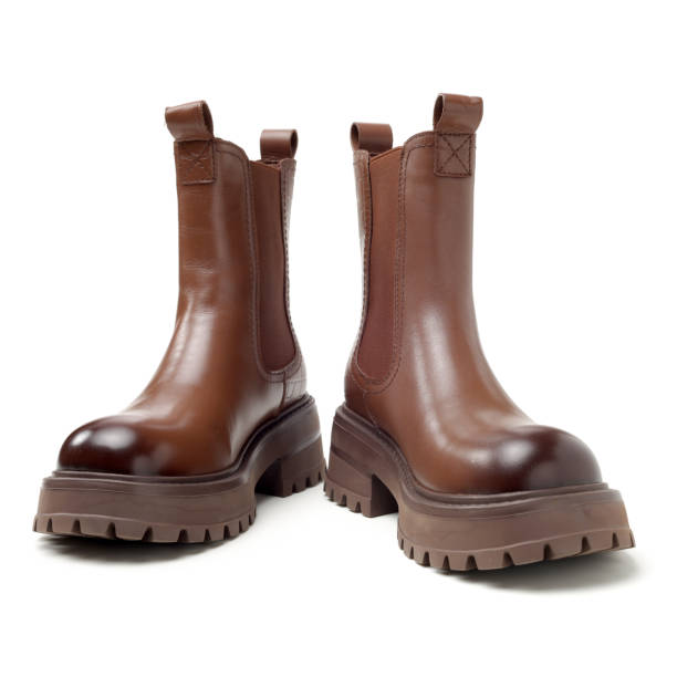 istock Women leather brown boots on white background 2052671982
